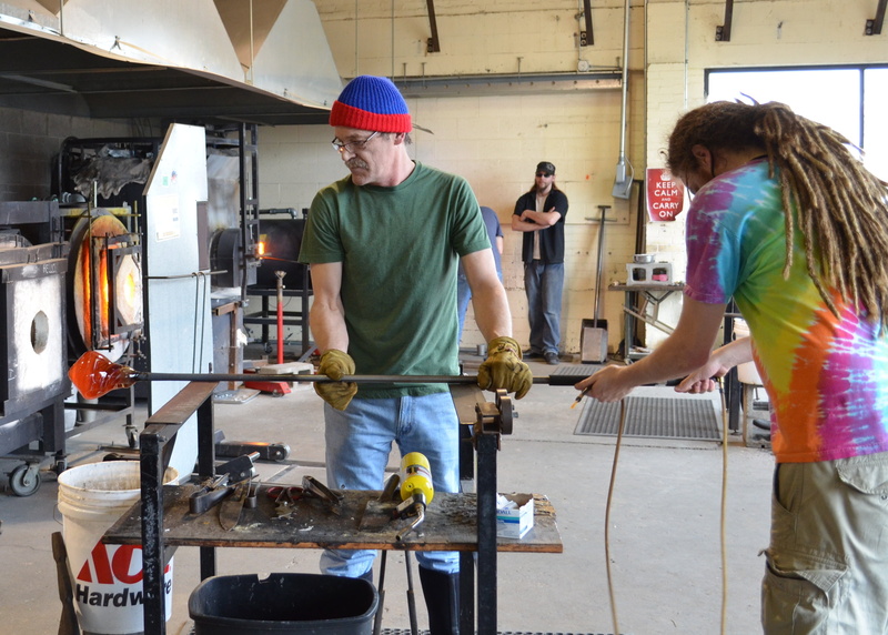 occupation, two people, people, heat, standing, blower, warm, glowing, melting, hat, mid adult, blowing, blow, day, indoors, holding, glass, furnace, craft