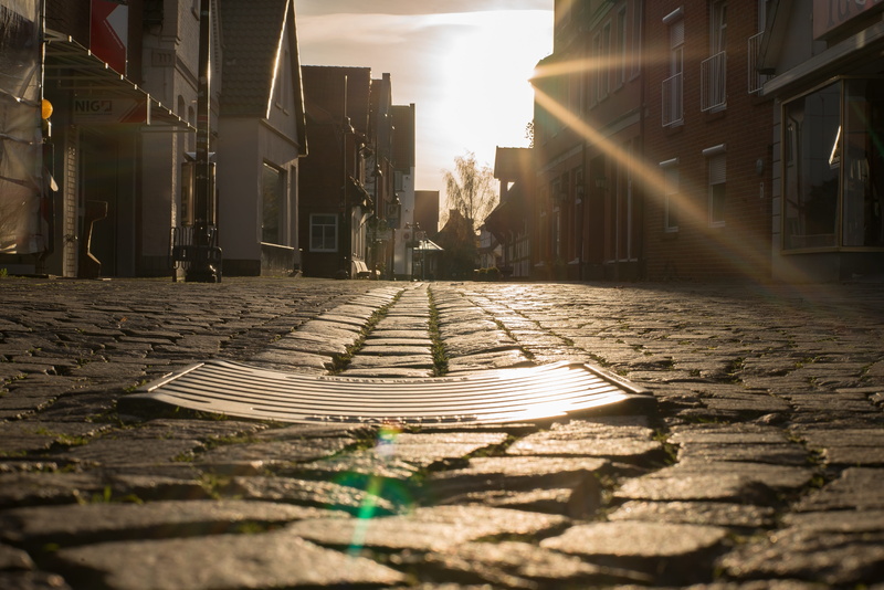 background, pattern, sunbeam, architecture, 4K, wastewater, footpath, sunlight, Drain, surface level, outdoors, cobblestone, wet, Road, away, metal, shadow