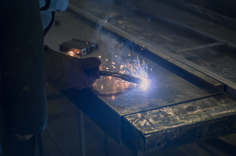 flower, lighting, flame, accuracy, fire, metal industry, gray, alloy, metal, plant, sparks, human, protection, one person, apparel, helmet, building, indoors
