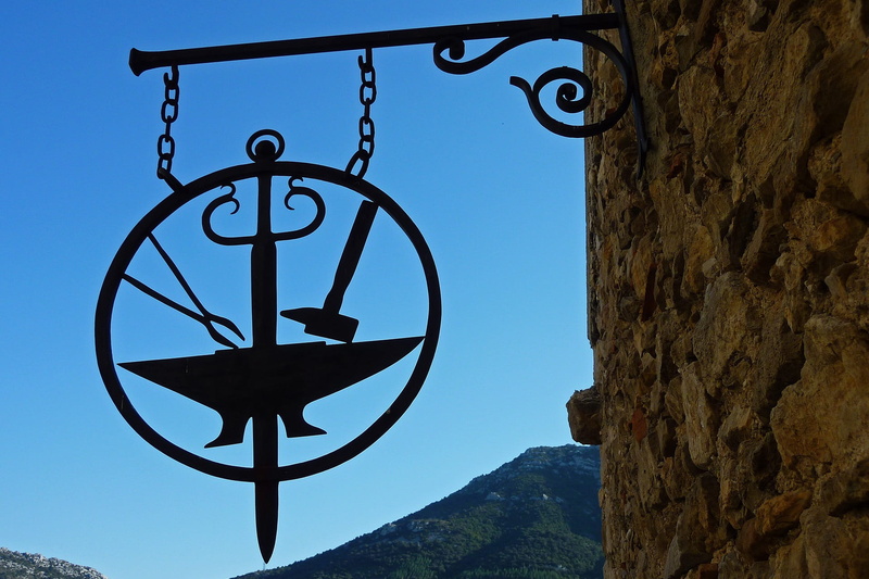 1080P, crafts, street, urban setting, hanging, focus on foreground, shop, set designer, history, mountain, architecture, day, iron, metal art, lighting equipment