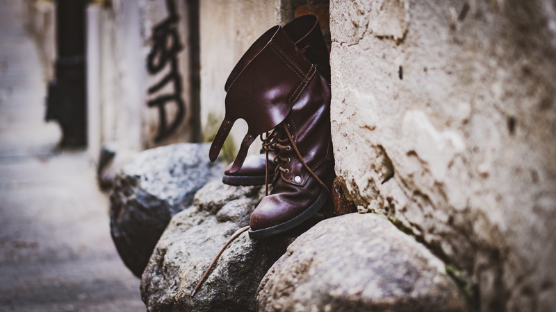 old, brown, boots, building, clothing, fashion, nature, focus on foreground, boot, woman, rock - object, built structure, day, isolated, wall - building feature