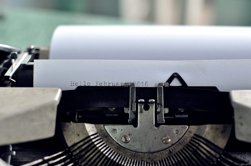 machinery, ribbon, typed, type, paper, communication, thread, metal, outdoors, technology, no people, machine part, focus on foreground, old-fashioned