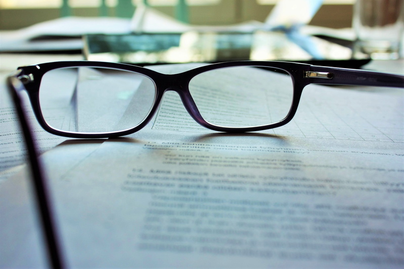 text, top, glasses, study, printer, table, eyewear, newspaper, reading glasses, framed, eyeglasses, book, publication, business, indoors, no people, close-up