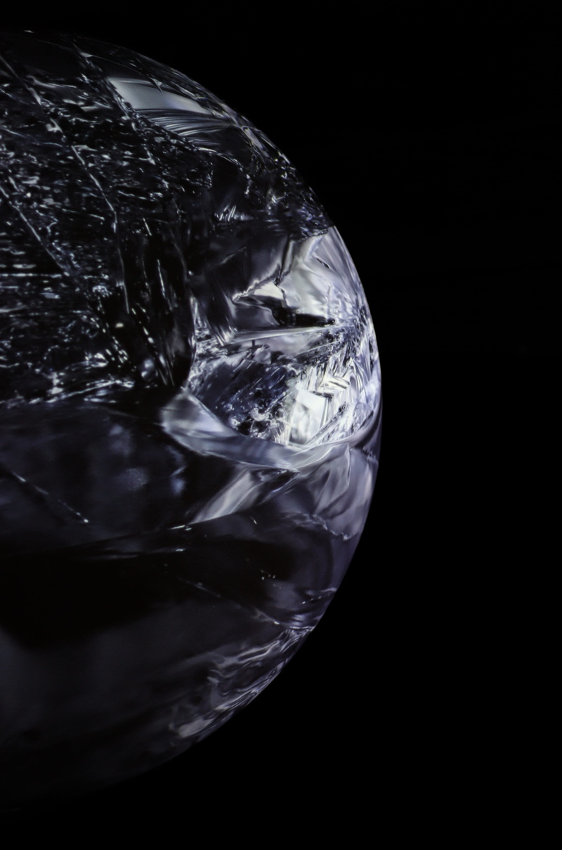 astronomy, outdoors, household equipment, copy space, transparent, drink, still life, sphere, space, reptile, close-up, indoors, nature, black, glass, water