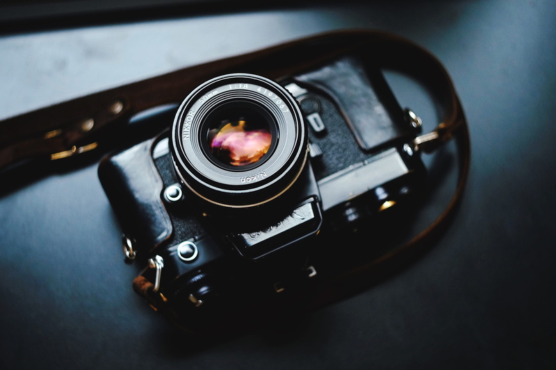 single object, equipment, high angle view, classic, lens, vintage, 4K, black, black color, close-up, digital camera, table, analog, focus on foreground