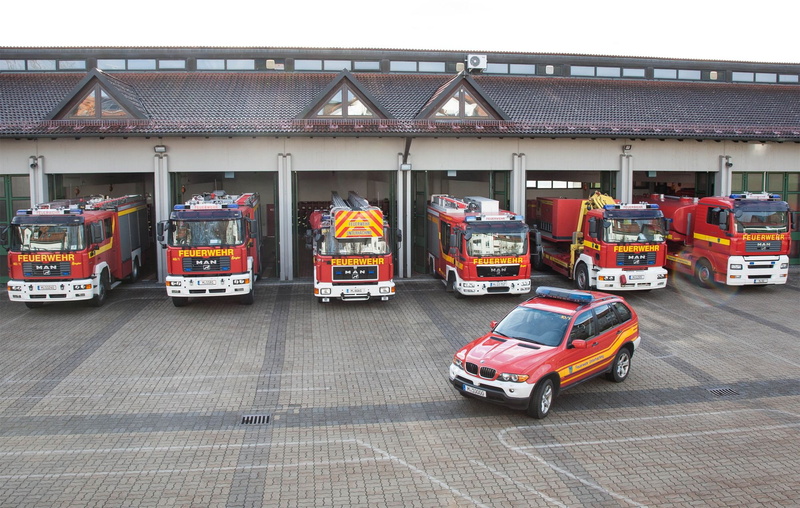 emergency, fire, firetruck, truck, road, car, city, architecture, mode of transportation, building exterior, outdoors, no people, transportation, public transportation
