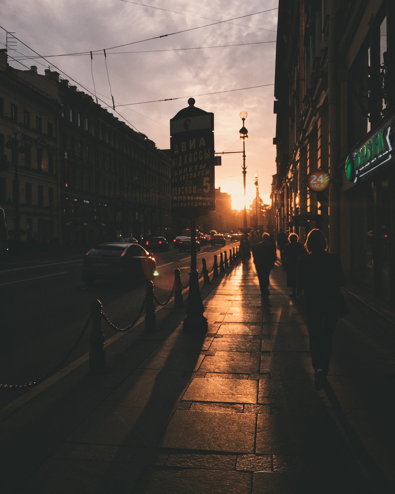 built structure, street, motor vehicle, silhouette, sunset, city street, architecture, city life, real people, city, building exterior, sundown, footpath