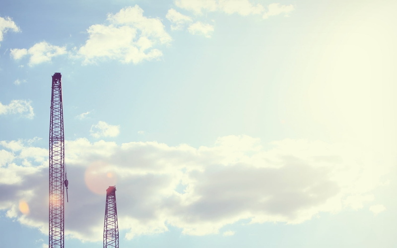 hoists, clouds, nature, copy space, tranquility, two, gray, towers, architecture, arts culture and entertainment, city, beauty in nature, low angle view