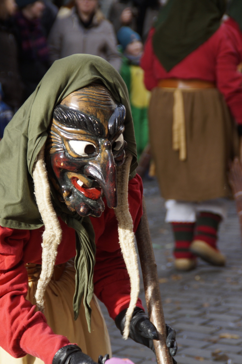 guild group, real people, masquerade, dressed up, custom, larva, disguise, incidental people, obscured face, outdoors, mask - disguise, profile, haestraeger