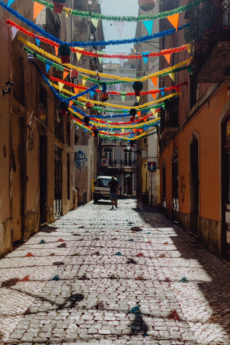 lisbon, streets, paving stone, mode of transportation, alley, building exterior, festival, travel, men, direction, decorated, the way forward, saint, garland