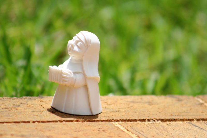 playing the accordion nun, singing nun, sculpture, small, sunlight, figurine, 2K, nature, statue, art and craft, single object, playing nun, representation