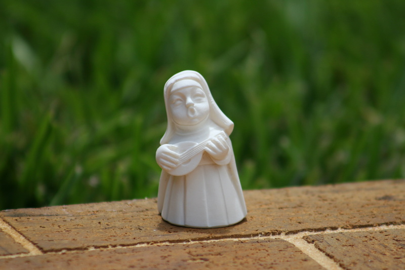 no people, creativity, male likeness, representation, sculpture, female likeness, playing guitar nun, catholic, growth, plant, day, religious, focus on foreground