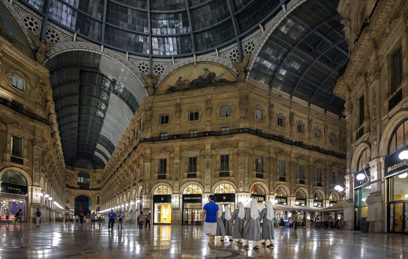 history, group of people, city, arch, women, blue, indoors, europe, real people, the past, shirt, milan, walking, large group of people, architectural column