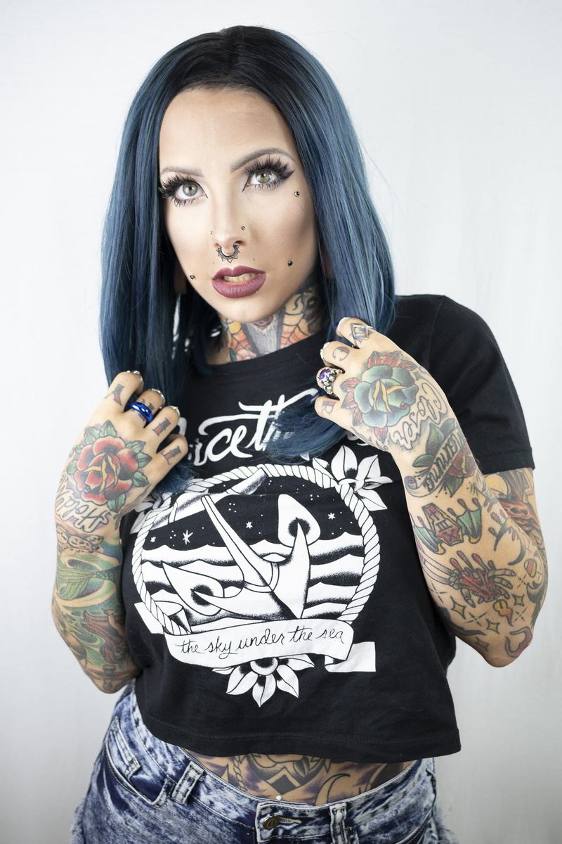 beautiful, tattoos, hairstyle, female, casual clothing, waist up, shirt, wearing, fashion, nose ring, model, looking at camera, blue, style, photoshoot