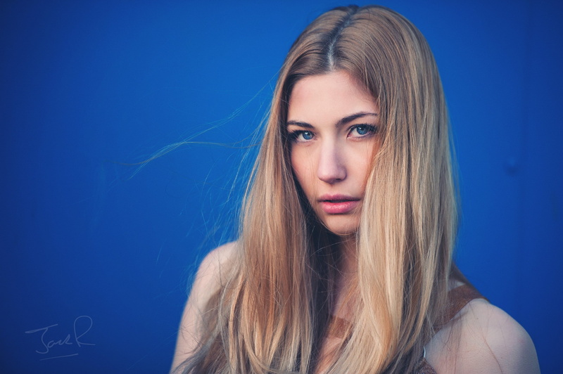 young adult, hairstyle, one person, human face, blue background, fashion, blond hair, beautiful woman, headshot, beautiful people, hair, women, adult, human hair
