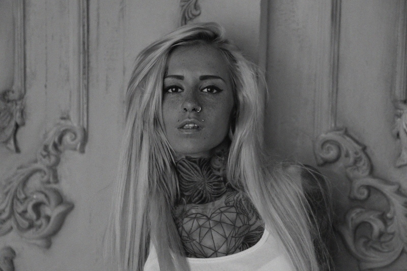 creativity, portrait, human face, one person, angel, indoors, women, bantik boy model tattoo monochrome blonde nose rings piercing, looking at camera, headshot