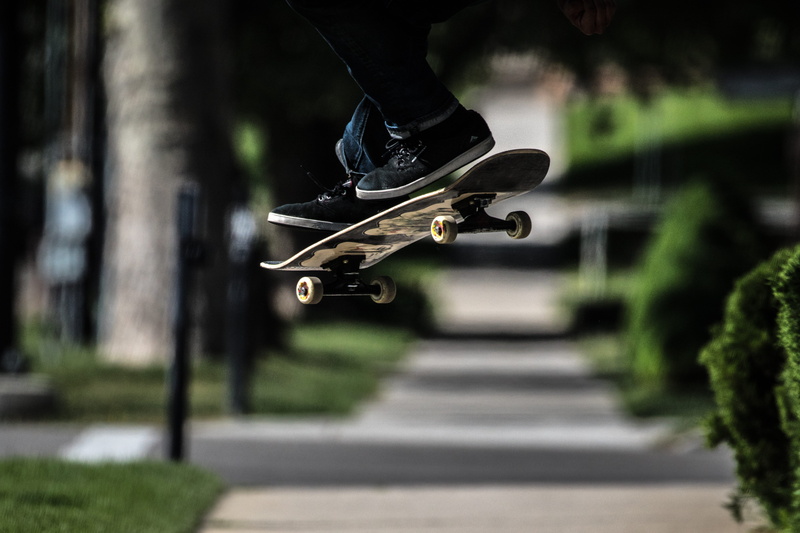 low section, outdoors, skateboard, near, trick, urban, man, flip, pop, body part, sport, board, 5K, playing, exhibition, human limb, human leg, leisure activity
