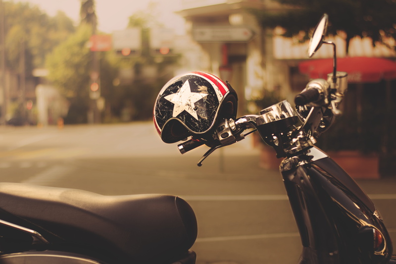 helm, scooter, sports equipment, vintage, day, headwear, sports helmet, motorcycle helmet, close-up, human body part, street, outdoors, nostalgia, vespa