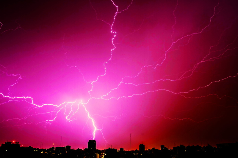 lightning strike, urban, silhouette, buildings, thunderbolt, power, ominous, beauty in nature, flash, pink color, storm, power in nature, thunderstorm