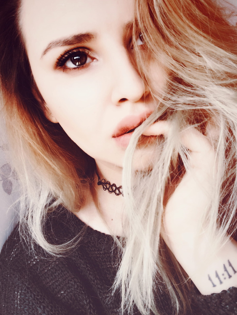 close-up, contemplation, looking at camera, long hair, cute, pretty, front view, person, human face, hair, real people, blonde, hairstyle, lifestyles, top