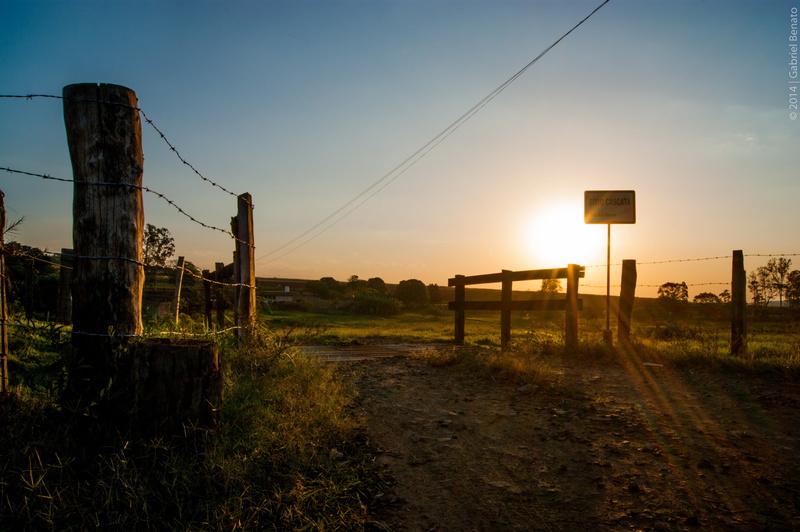 tranquility, sign, sky, grass, landscape, silhouette, land, no people, nature, barrier, sunset, direction, outdoors, environment, field, plant, fence, wooden post