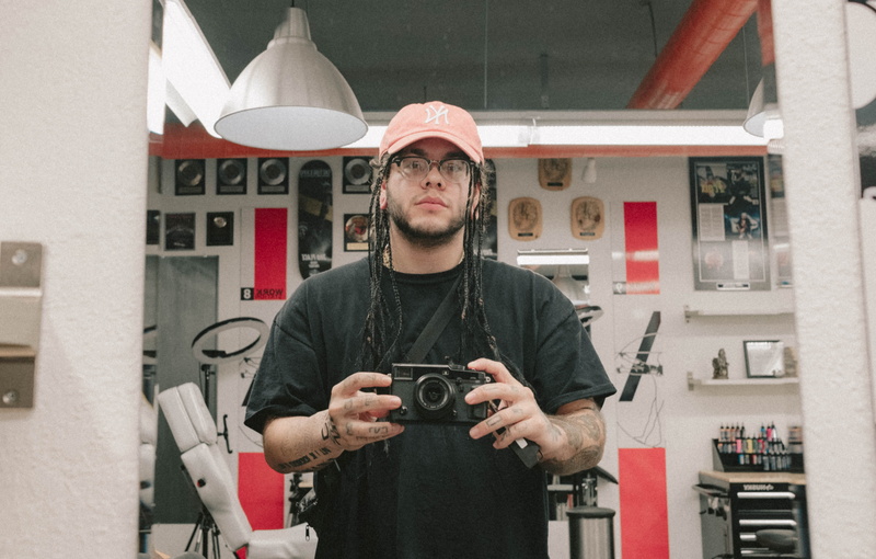 5K, person, projector, human, shorts, casual clothing, technology, front view, glasses, antique, camera - photographic equipment, lifestyles, t, one person