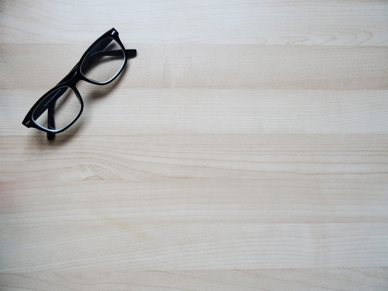 high angle view, indoors, eyeglasses, wood texture, glasses, healthcare and medicine, equipment, brown, no people, eyewear, wood - material, wood, framed