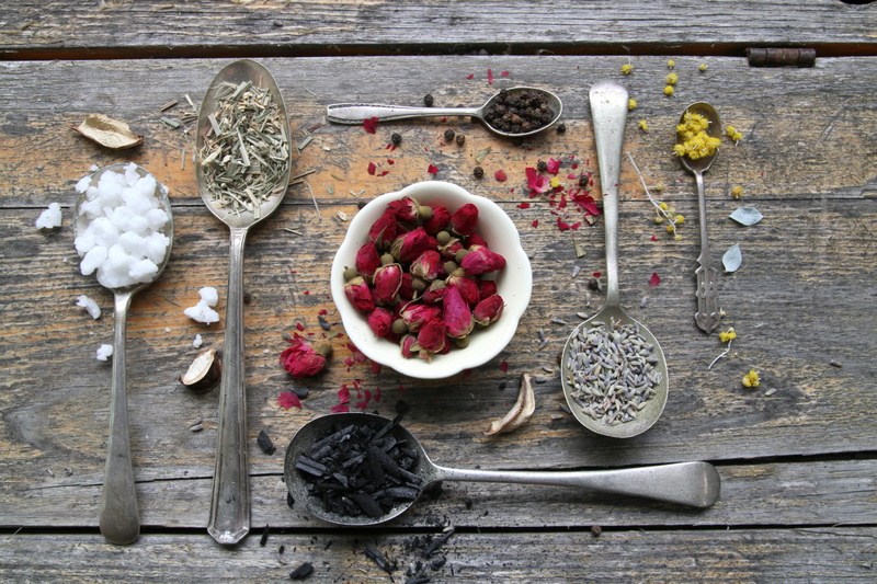 wellbeing, scents, coconut oil, no people, choice, high angle view, indoors, eating utensil, kitchen utensil, wood - material, flower, spoon, table, charcoal