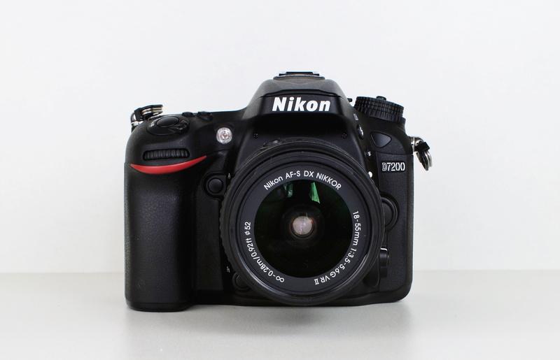 indoors, photography, slr camera, flash light, photography themes, nikon 7200, close-up, black color, images, studio shot, lens - optical instrument, digital camera