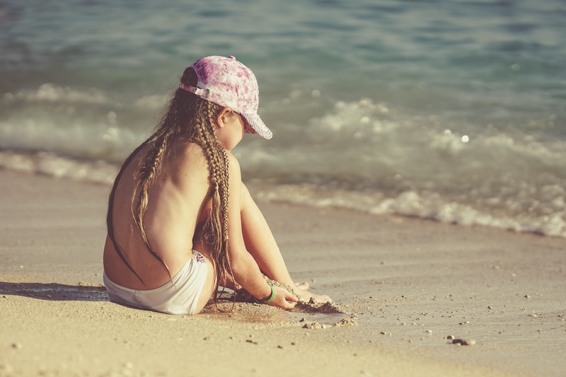 sand, focus on foreground, land, women, children, day, ölüdeniz, beach, braid, sea, one person, sitting, females, real people, lifestyles, leisure activity