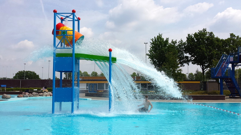 summer, spraying, turquoise colored, nature, splashing, built structure, holiday, building exterior, people, slide - play equipment, sky, architecture