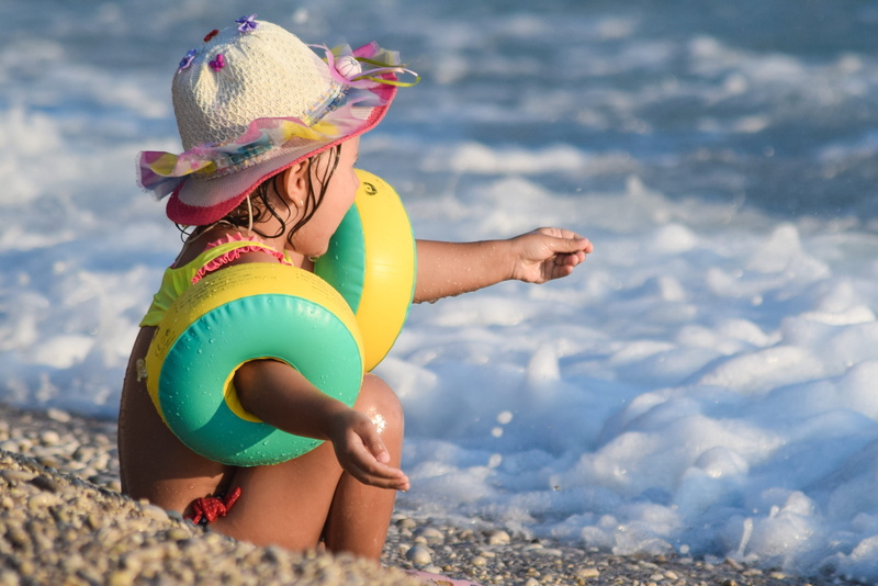 leisure activity, waves, clothing, one person, day, inflatable, vacations, child, 2K, water, sea, sunlight, outdoors, fun, rubber rings, holiday, beach