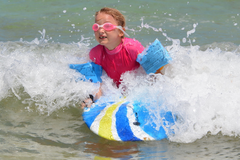 surf, outdoors, motion, inflatable, beach, emotion, waves, rubber rings, leisure activity, fun, sports, innocence, one person, mouth open, splashing, summer