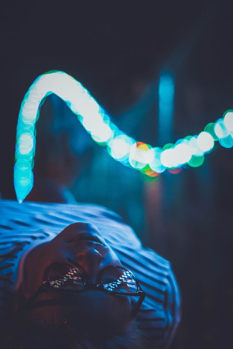 lights, lighting equipment, glowing, canon, real people, blue, focus, bright, leisure activity, person, focus on foreground, closeup, shallow, human body part