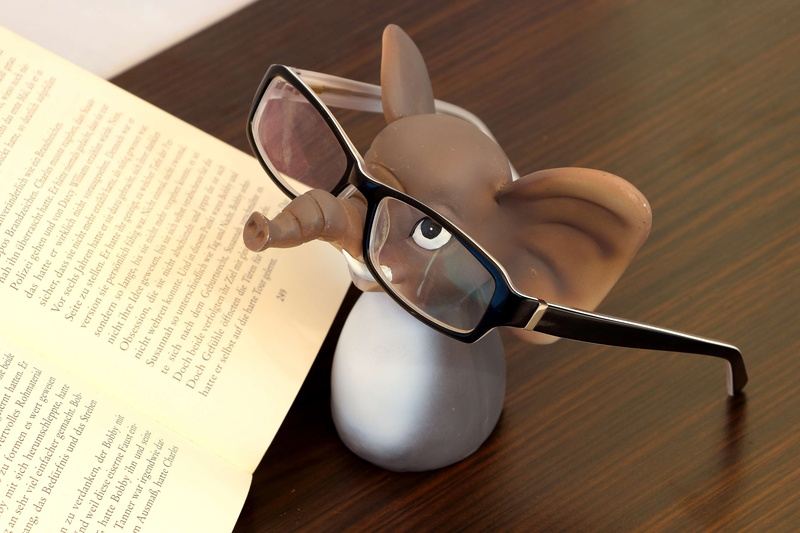 open, black glasses, reading aid, figurine, wood - material, still life, no people, page, publication, kitchen utensil, eyeglass frame, reading glasses