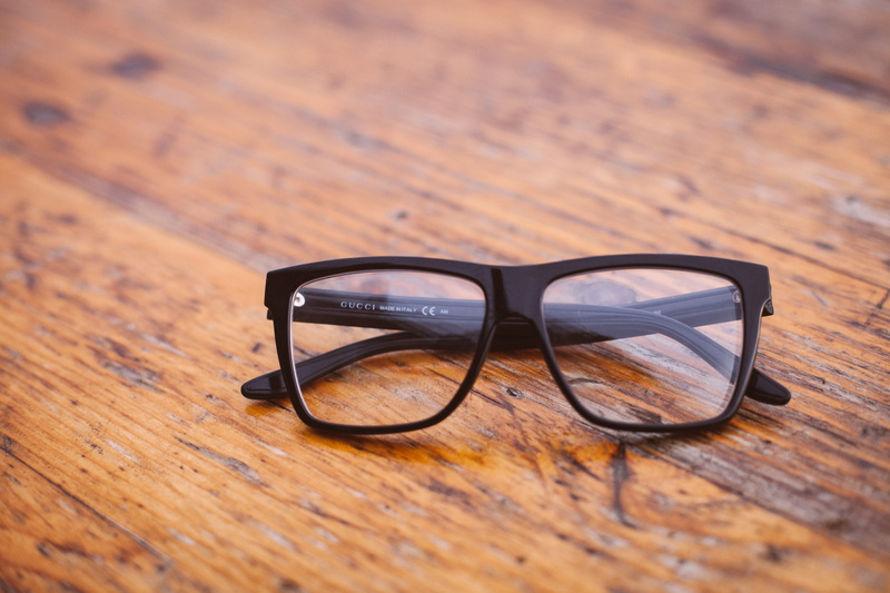 focus on foreground, framed, eye-sight, eyesight, glass - material, 5K, optometry, wayfarer, high angle view, eyeglasses, single object, wooden, surface