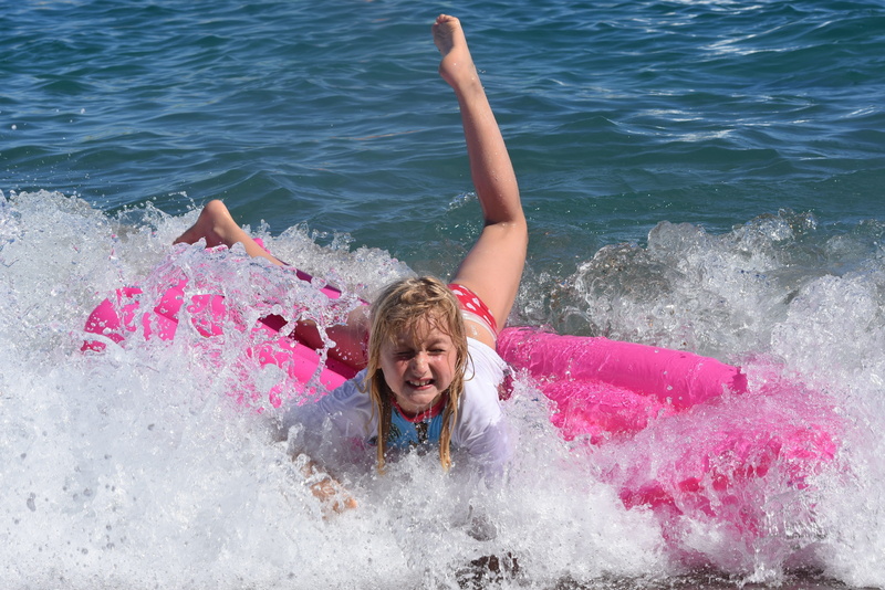 real people, day, nature, girl, fun, childhood, leisure activity, motion, one person, outdoors, uv-resistant clothing, girls, holiday, waves, portrait