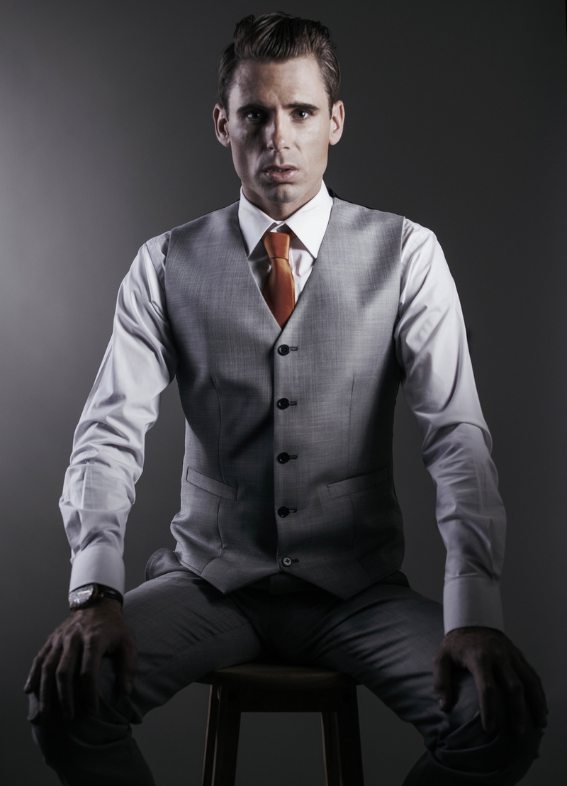 fashionable, posing, one person, wear, portrait, stool, outfit, front view, formal wear, 8K, black background, good-looking, young adult, man, photo, fine-looking