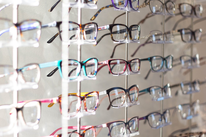 spectactles, large group of objects, silver colored, rack, eye care, assorted, healthcare and medicine, repetition, indoors, close-up, glasses, in a row