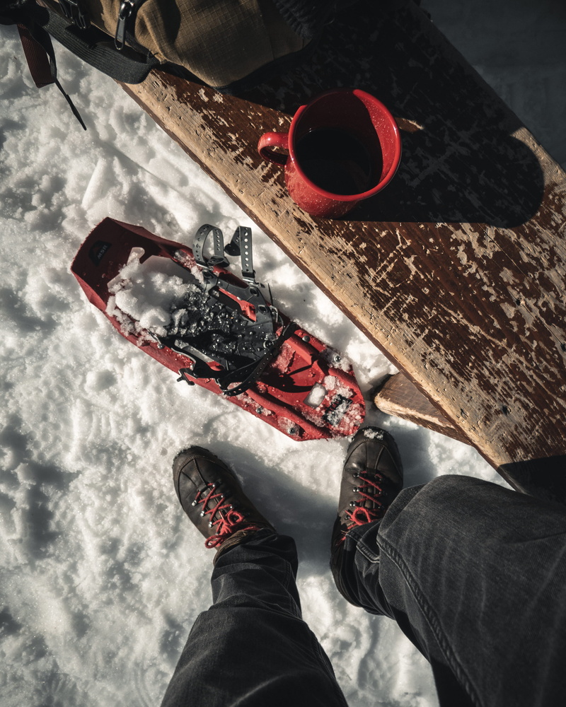 personal perspective, indoors, clothing, flooring, sport, snow, wood, sportaccessories, person, standing, human leg, jeans, footwear, high angle view, day
