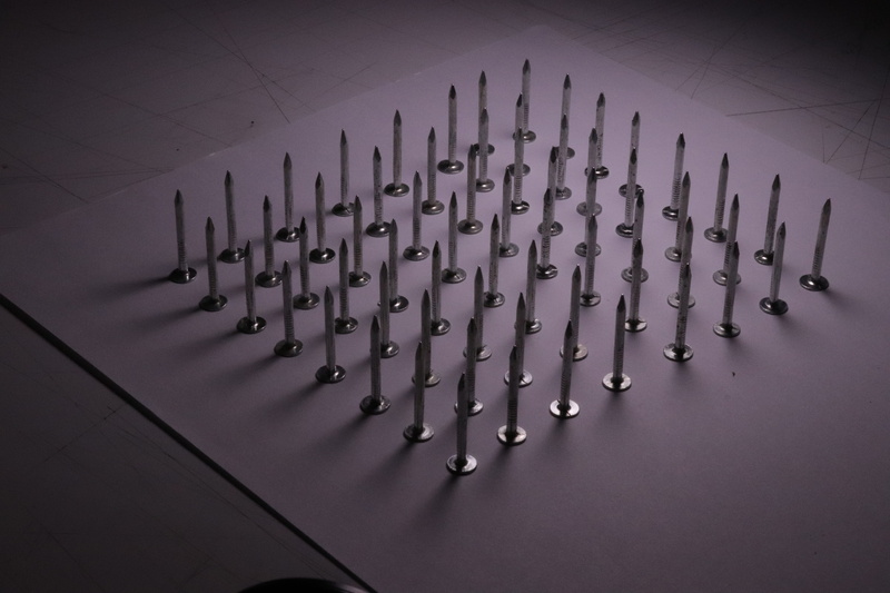 large group of objects, security, pattern, silver colored, in a row, repetition, shadow, shadows, music, metallic, sharp, arrangement, indoors, textured