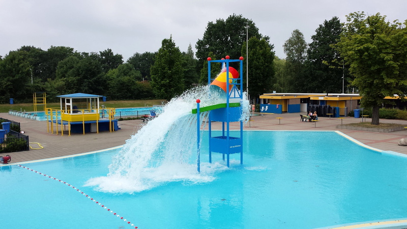 men, plant, lol, outdoors, unconcernedly, tree, incidental people, sky, swimming, water slide, architecture, splashing, playground, people, inflatable