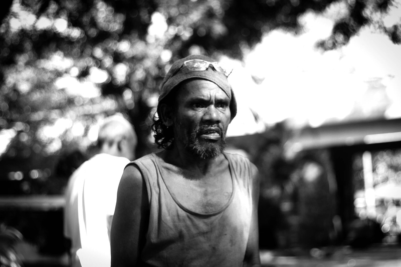one person, facial hair, poor, casual clothing, leisure activity, outdoors, real people, front view, black and white, standing, lifestyles, portrait, waist up