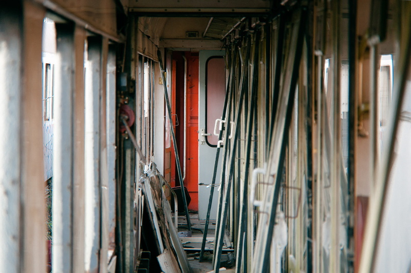 door, choice, abandoned, room, indoors, metal, built structure, hanging, trashy, multi colored, broken, curtain, wreck, day, urban, entrance, textile, variation
