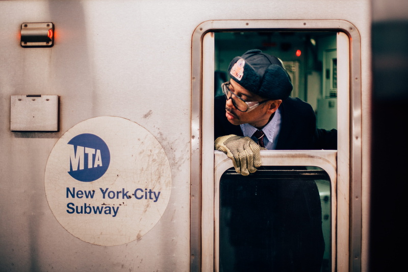 text, mtum, sign, adult, looking, occupation, males, underground, 5K, day, work, new, city, peeking, transportation, door, technology, carriage, train