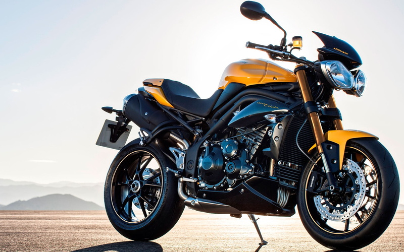 triple, travel, day, road, crash helmet, mode of transportation, outdoors, yellow, street, wheel, nature, speed, tire, parking, black, Motorcycles, Triumph