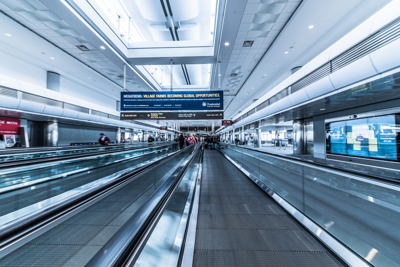 incidental people, airport, indoor, inside, motion, standing, architecture, airport departure area, ceiling, modern, walkalator, sign, 5K, illuminated