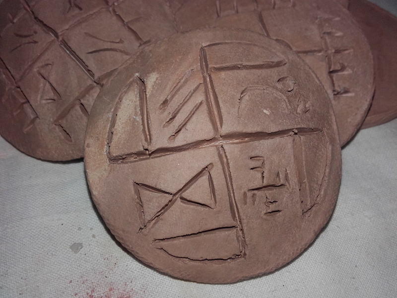 carving - craft product, western script, day, amulets, craft, high angle view, art and craft, emotion, text, communication, brown, solid, message, still life