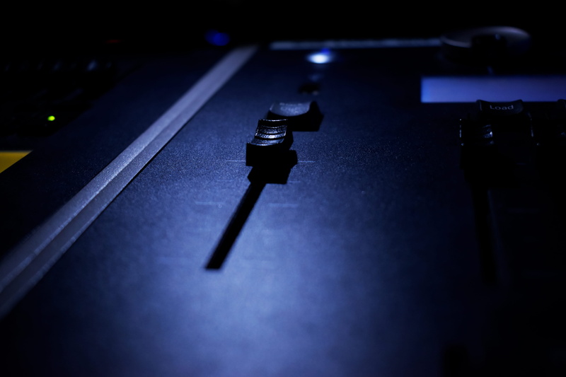 desk, no people, dark, selective focus, close-up, nightlife, sound recording equipment, technology, indoors, slider, table, display, night, nightclub, turntable