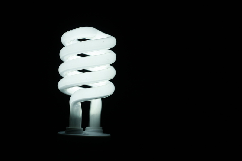 copy space, bulb, spiral, single, environmental conservation, energy efficient lightbulb, fuel and Power Generation, 4K, black background, glowing, bright
